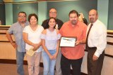 Members of Ernesto Vigil's family accept a proclamation for their late father. L to R, James Vigil, daughter Lola Spain, Ray Vigil (back), Paul Vigil and Mayor Ray Madrigal.